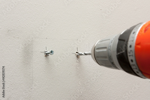 drilling hole in a wall