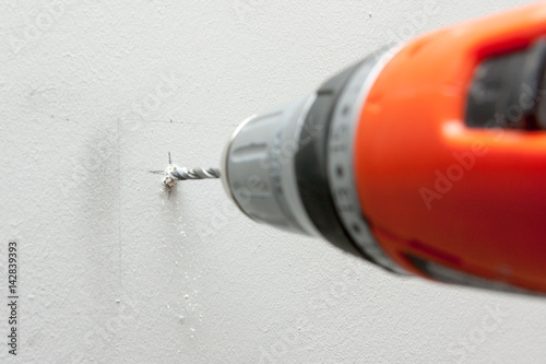 drilling hole in a wall