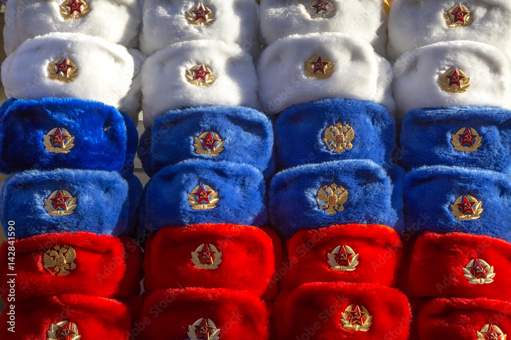 Fototapeta premium Many colored in Russian tricolor military hats Soviet and Russian army at Moscow's street