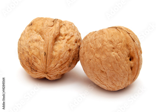Dry walnuts in shell isolated on white background. Flat lay, top view
