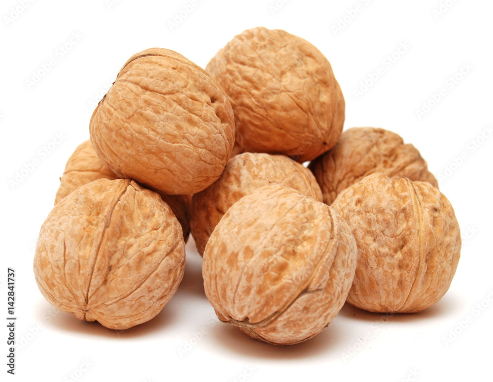 Dry walnuts in shell isolated on white background. Flat lay, top view Dry walnuts in shell isolated on white background. Flat lay, top view