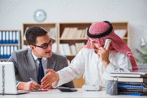 Diverse business concept with arab businessman photo