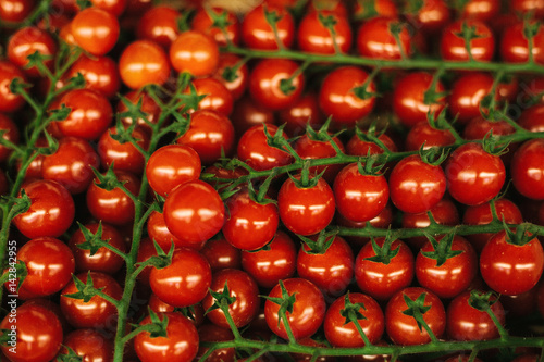 Red fresh tomatoes background. Natural local products on the farm market. Harvesting. Seasonal products. Food. Vegetables.