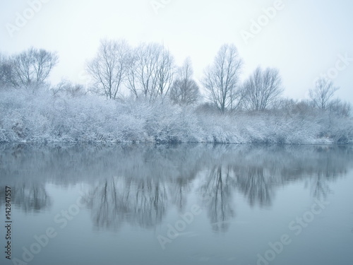 Winter river in the early misty morning