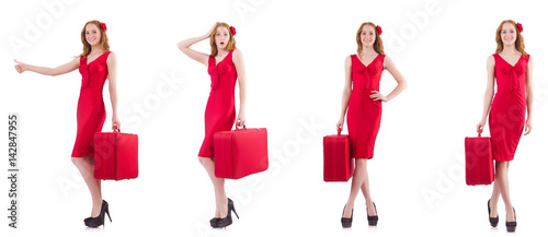 Young woman in red dress with suitcase isolated on white