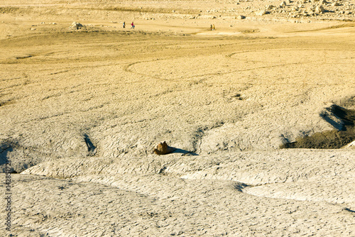Climate change concept, dried surface of desert ground. Big cracks and fractures of lake sediments