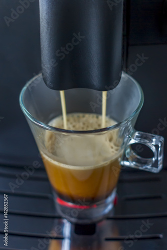 coffee machine prepares a cup of americano