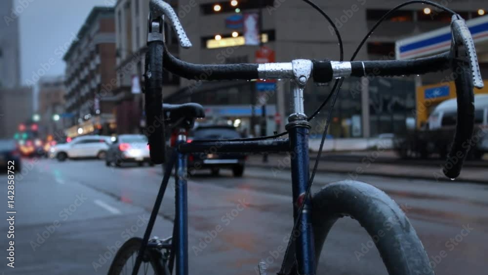 Generic Bicycle in the rain in metropolitan Pittsburgh on evening Generic Bicycle in the rain in metropolitan Pittsburgh on evening