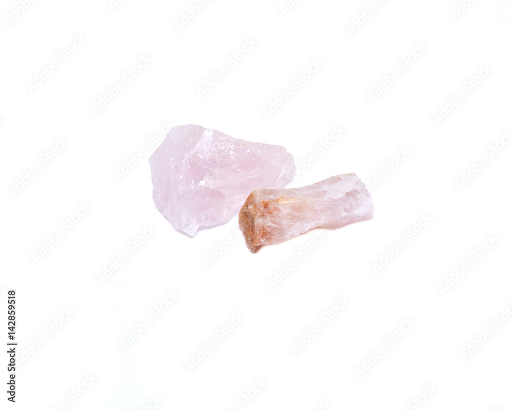 Rose quartz chunks from Madagascar isolated on white background Rose quartz chunks from Madagascar isolated on white background