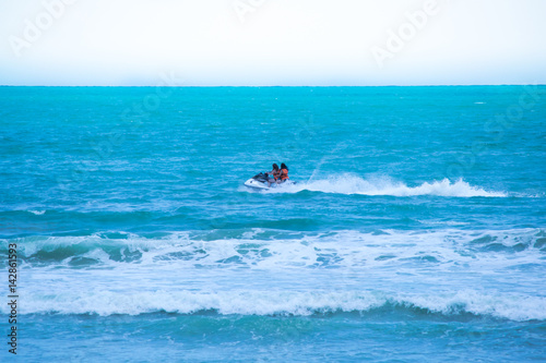 Two girls enjoying speedboat at the beach
