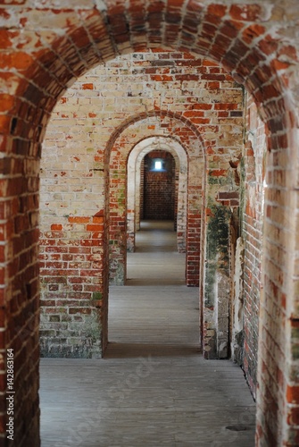 Brick archway doors hallway