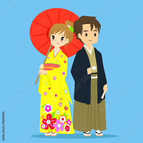 Japanese couple wearing traditional kimono. The woman holding an umbrella and the man holding a folding fan