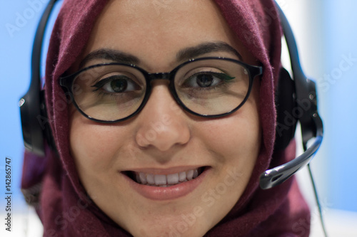 Portrait of young call center agent