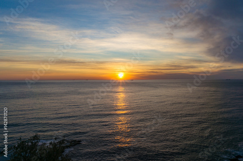 Sun with sunrays over ocean