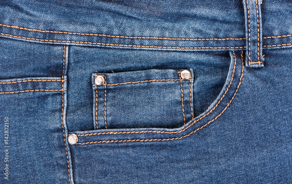 Jeans textile pocket close up. Detail of jeans pants. Jeans textile pocket close up. Detail of jeans pants.