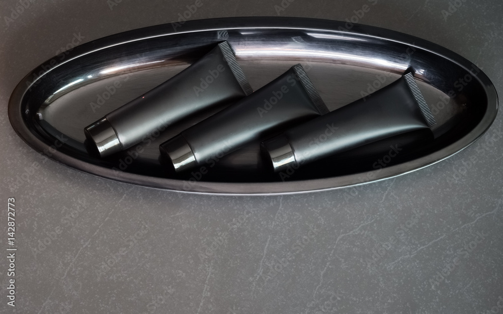 Bathroom set in black packages, Spa Kit. Top View with copy sapce