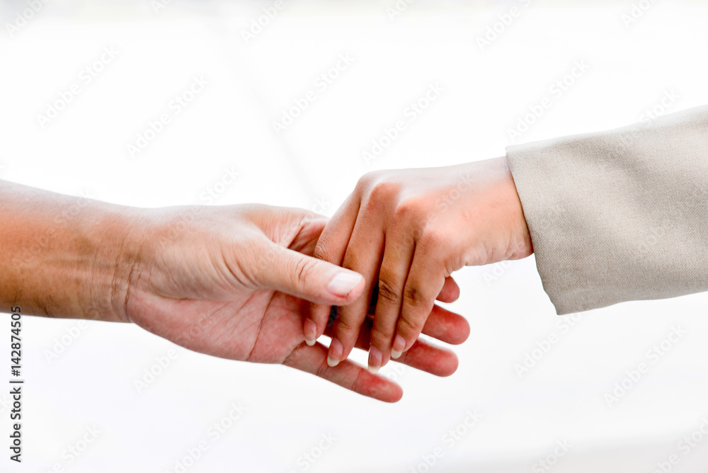 Obraz premium Close up view of business partnership handshake concept.Photo of two businessman handshaking process.Successful deal after great meeting., blurred background