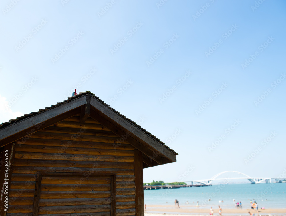 Landscape with wooden house and bridge over Chinese coastline. Landscape with wooden house and bridge over Chinese coastline.