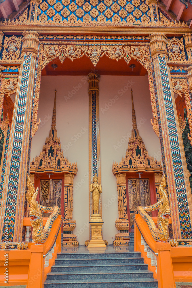 Fototapeta premium Ancient Thai temple. Wat Kosit Wihan golden Temple Phuket, Thailand.
