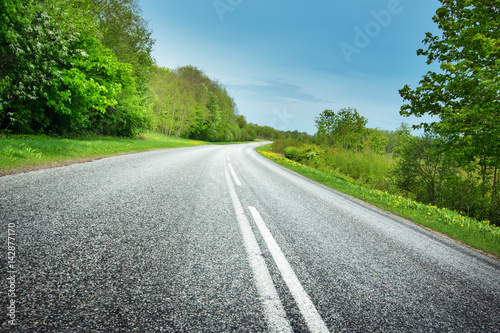 Asphalt road in beautiful spring day at countryside