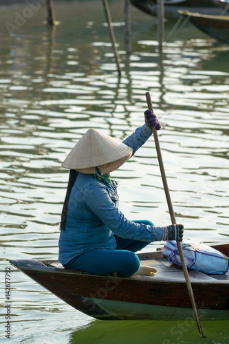 The boatwoman on the old national vietnamese boat