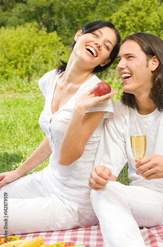 Young happy couple at picnic, outdoors