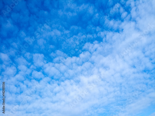 Cumulus clouds on a blue sky background