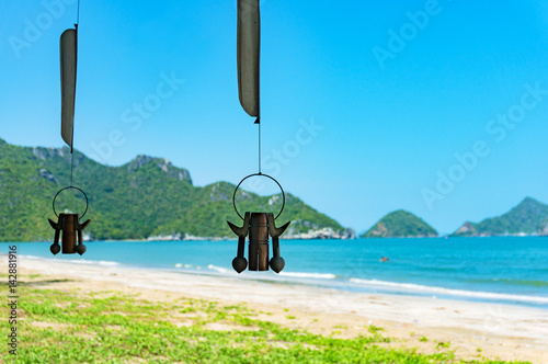 Photography Wind rattle with beautiful beach and mountains on the background