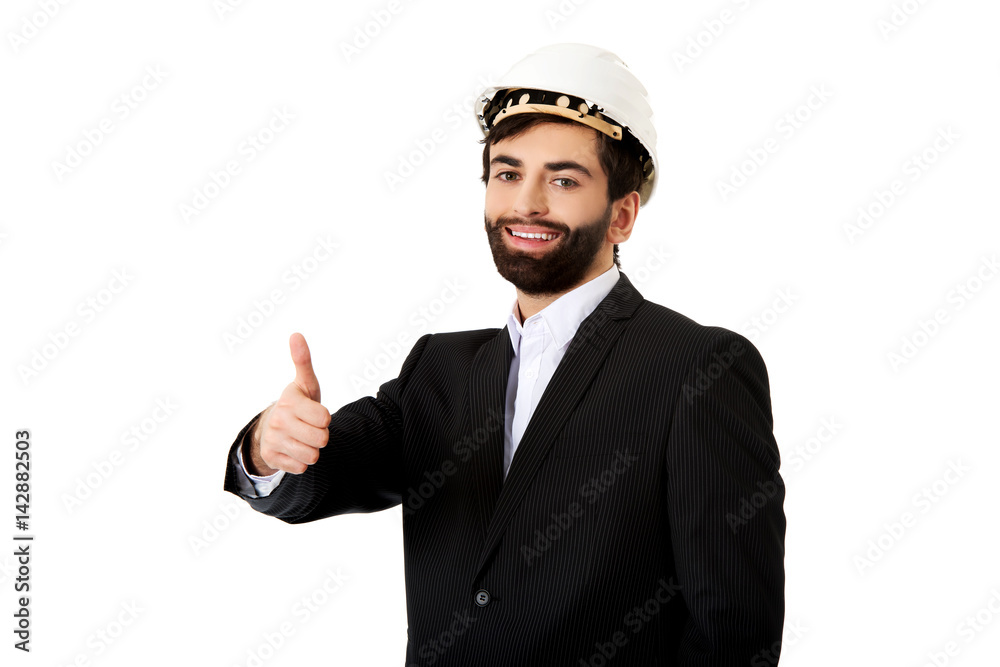 Engineer in protective helmet with thumbs up. Engineer in protective helmet with thumbs up.