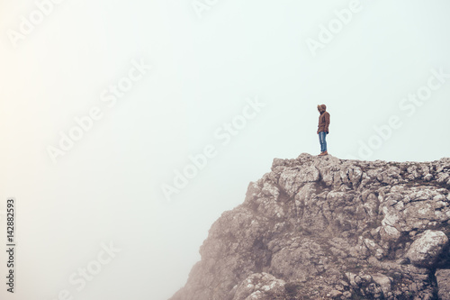 Man in mountains in fog