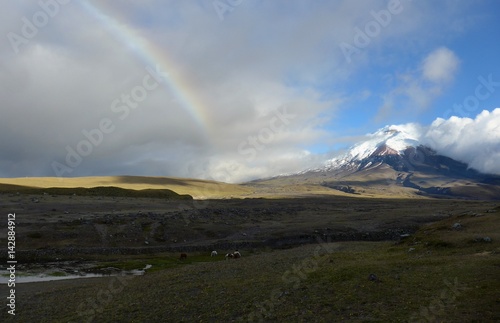 A rainbow across the open plains before Volcan Cotopaxi