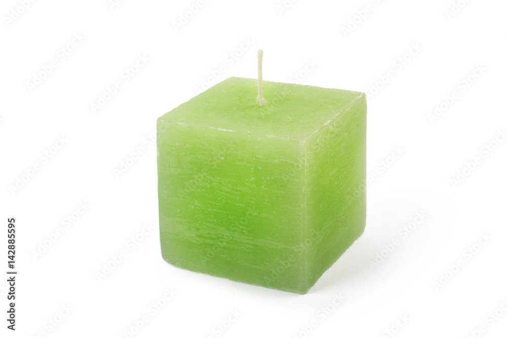 Green cube-shape candle on white background Green cube-shape candle on white background