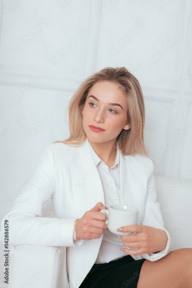 Portrait of beautiful young woman working in the office.