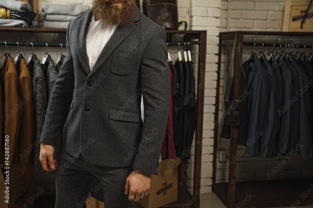 Handsome young bearded businessman in classic suit