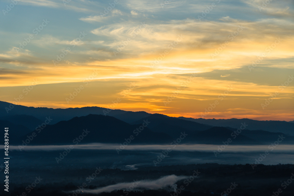 Misty morning sky above the mountains.