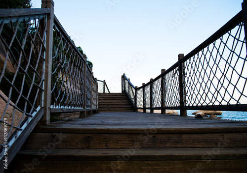 A wooden walkway on seaside. photo