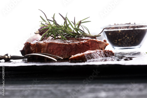 Barbecue Rib Eye Steak on Slate Slab - Dry Aged Wagyu Entrecote Steak photo