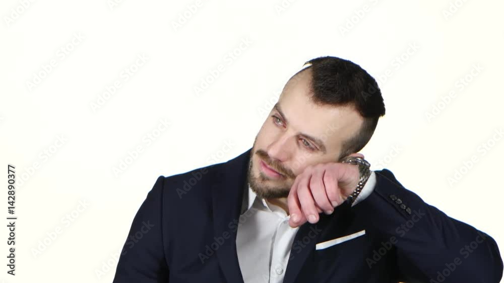 Businessman nervously waits and checks the his watch. White background Businessman nervously waits and checks the his watch. White background