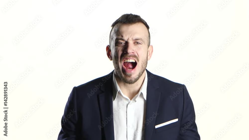 Man in business suit is screams and shouts, white background Man in business suit is screams and shouts, white background