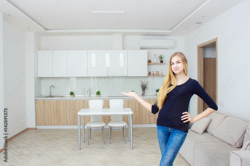 Real estate agent presenting modern house to client, woman Shows the kitchen. Real estate agent presenting modern house to client, woman Shows the kitchen.