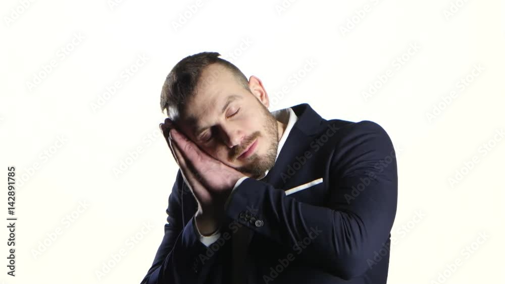 Man putting two hands under his head, pretends be asleep Man putting two hands under his head, pretends be asleep