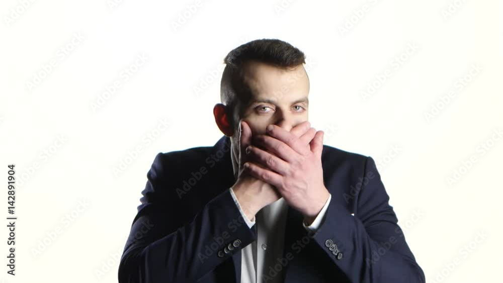 Man gestures shows mouth is locked and do not speak