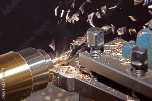 Cuadro en lienzo metal working on lathe grinder machine with flying shavings