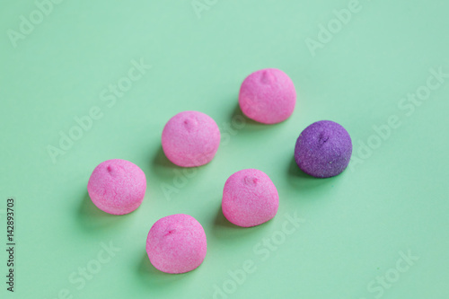 photo of tasty pink and purple marshmallows on the wonderful green studio background