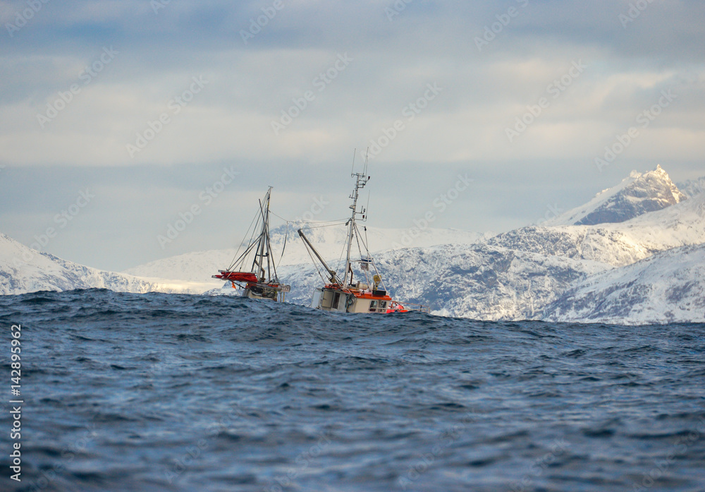 Obraz premium Alone fishing boat floating in the sea in Tromso, Norway