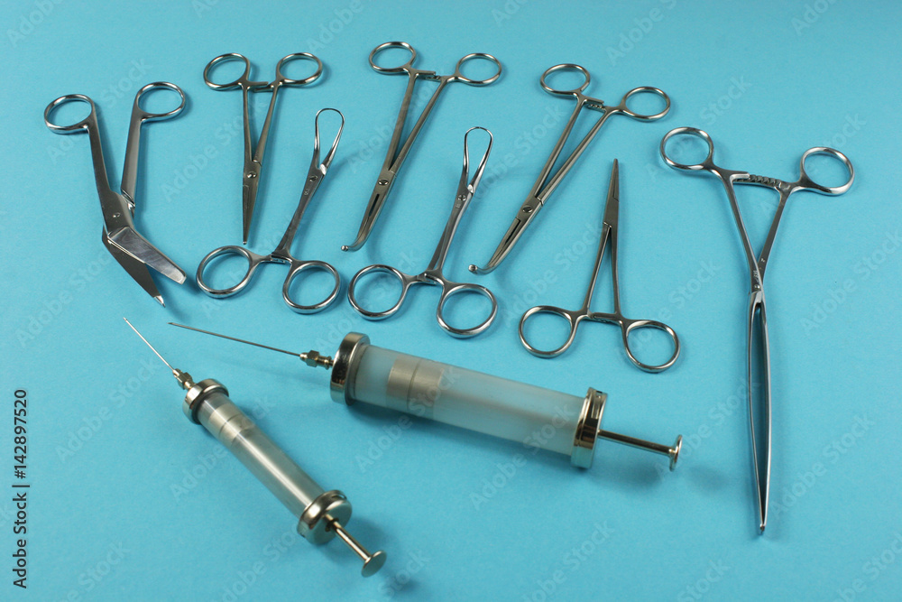 Surgical Instruments on blue background. Surgical Instruments on blue background.