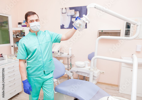 Male dentist in his office