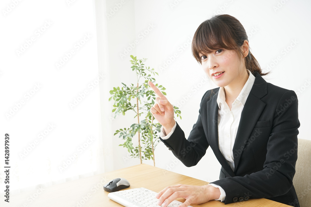 Young business woman using computer