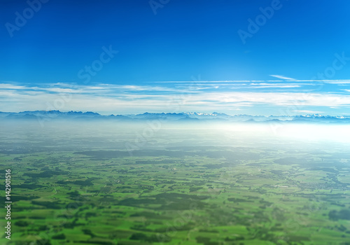 Aerial view of Alps and farmlands in Germany.