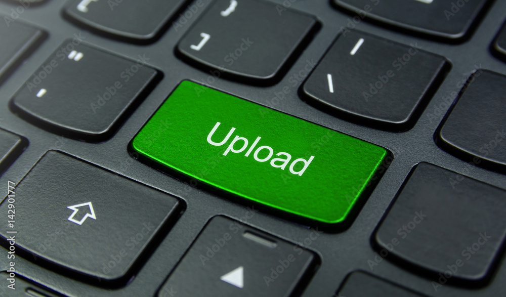 Close-up the Upload button on the keyboard and have Green color button isolate black keyboard Close-up the Upload button on the keyboard and have Green color button isolate black keyboard